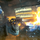An armored soldier shoots a rife at a target off screen.